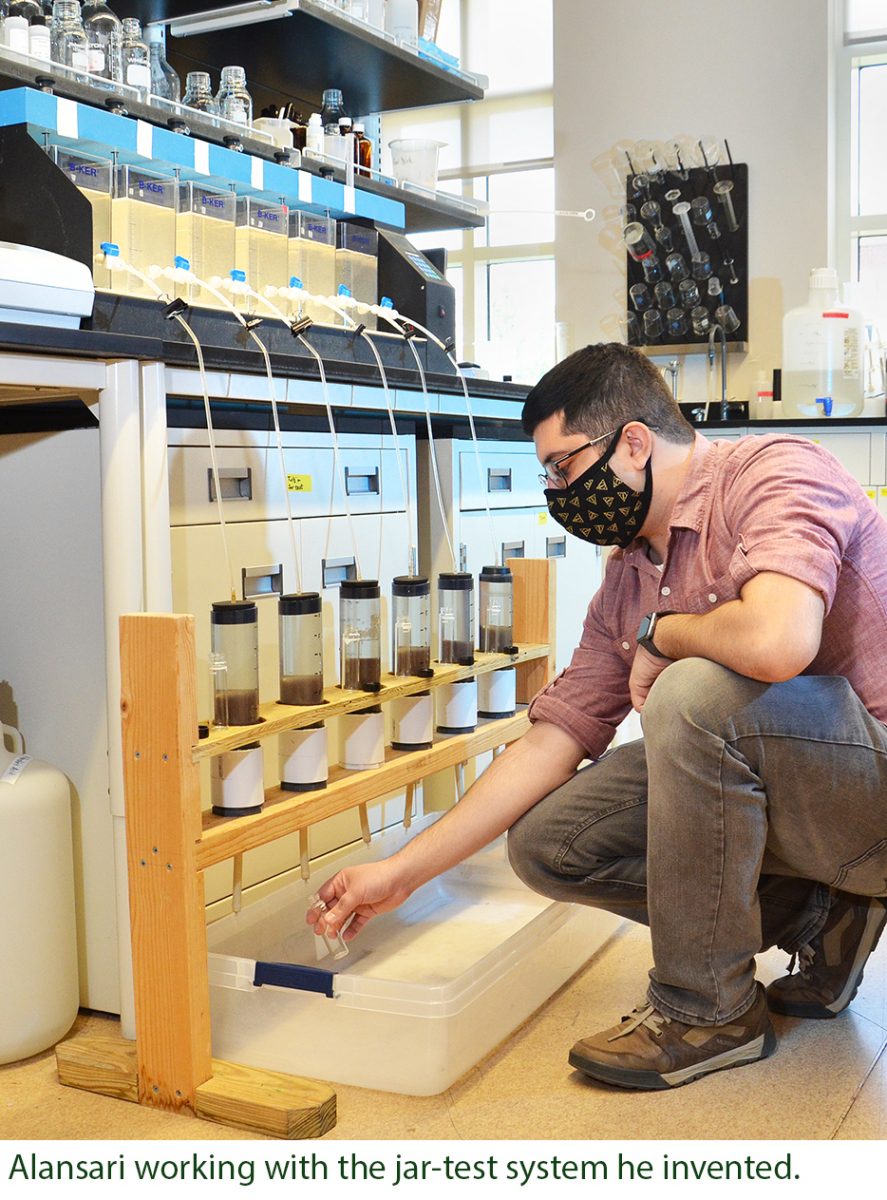 Amir Alansari working with the jar-test system he invented.