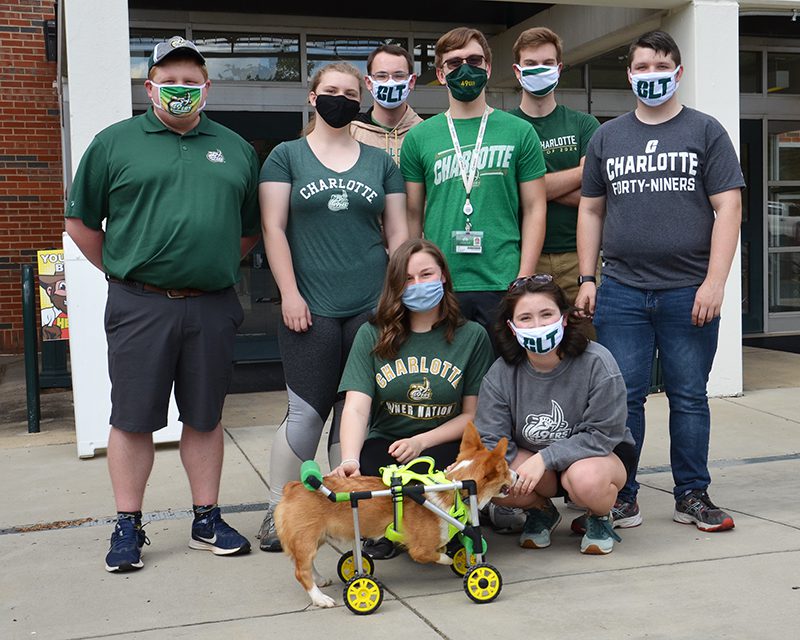 Engineering students pose with Boots the dog
