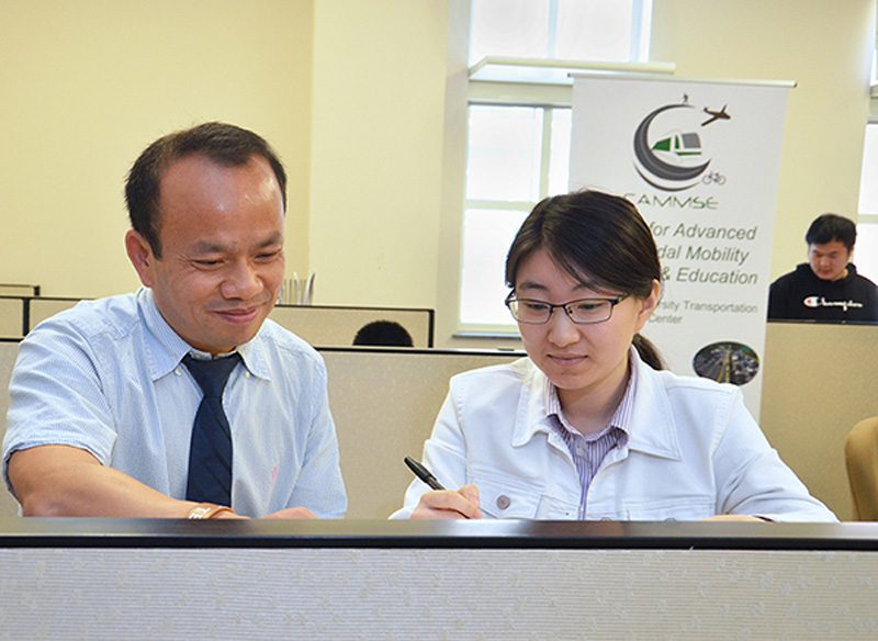 Dr. Wei Fan working with INES Ph.D. student Zijing Lin.