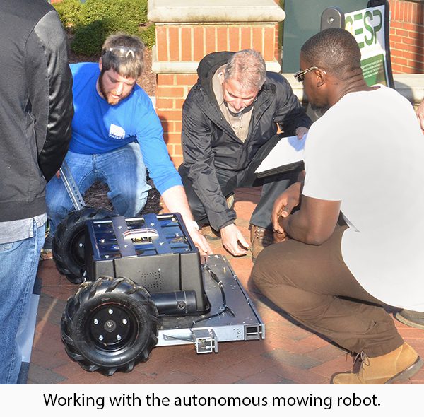 Students work with autonomous mowing robot