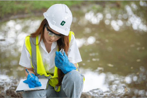 Engineer collecting water sample