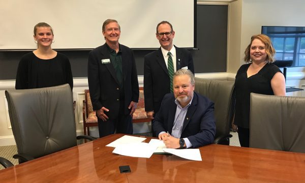 Ametek's Dave Mollish signs Donor Agreement for Full Tuition Scholarship