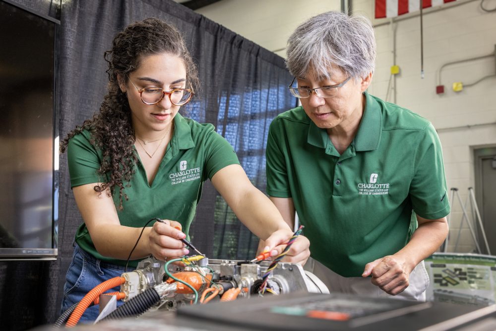 Professor and student working on an electrical project in BATT CAVE.