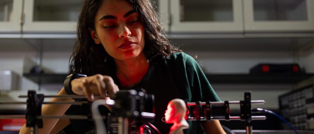 Student working with instrument in lab