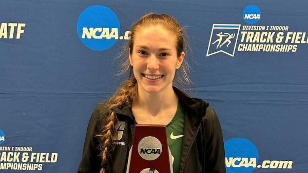Riley Felts holds NCAA runner-up trophy for pole vaulting