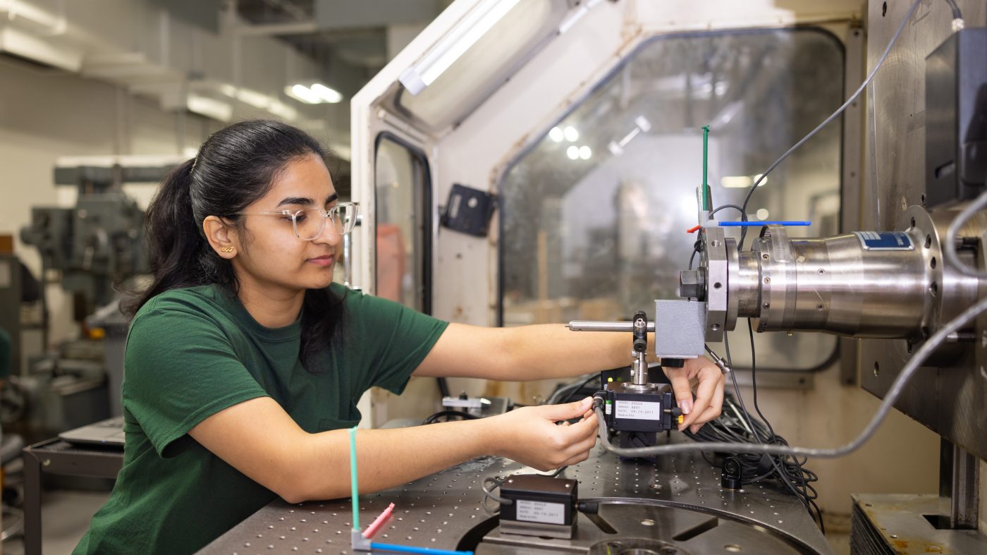 Student works on machine