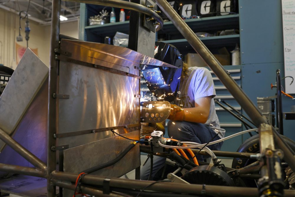 Student welding in the Kulwicki Motorsports Laboratory