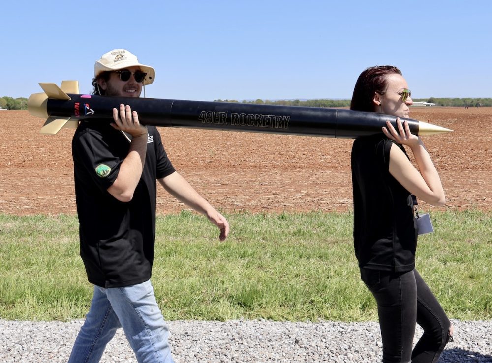 49er Rocketry Team members carry rocket to launch site
