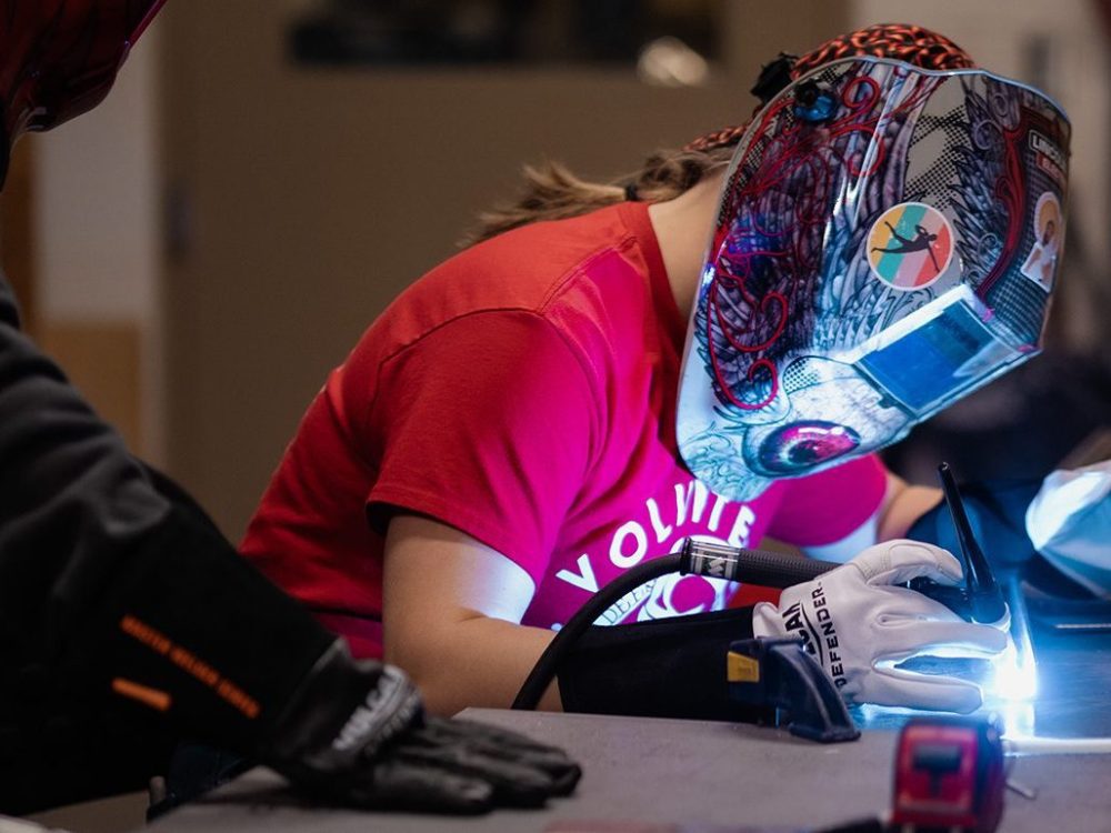 Civil engineering student works on project at table