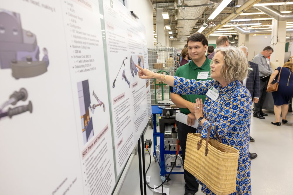 Students discuss senior design projects with guests, including elected officials, industry professionals and community leaders