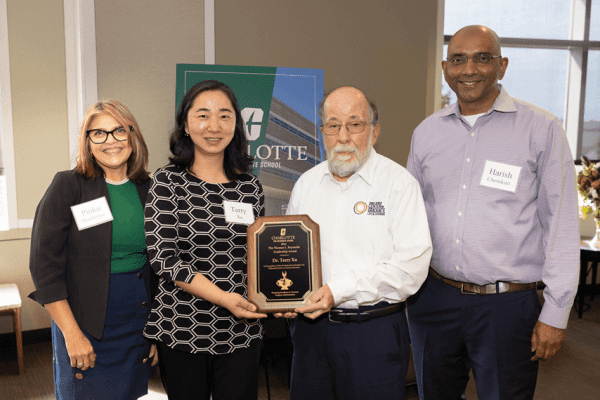 Terry Xu is presented with Thomas L. Reynolds Leadership Award