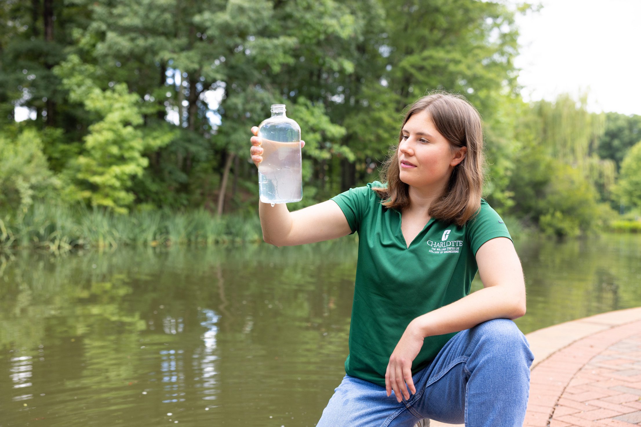 Jordan Landis collecting a water sample