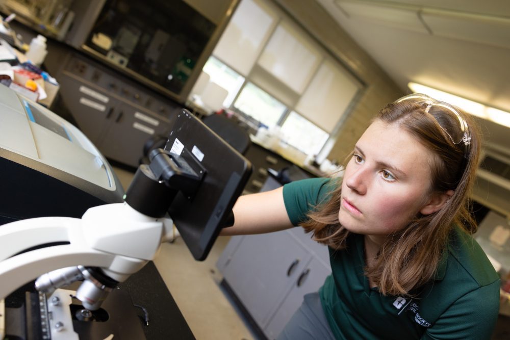 Jordan Landis reviewing water sample