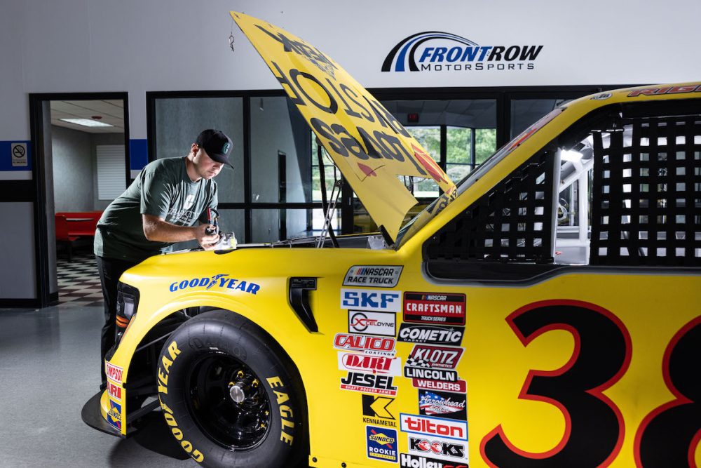 Layne Riggs working on his race truck