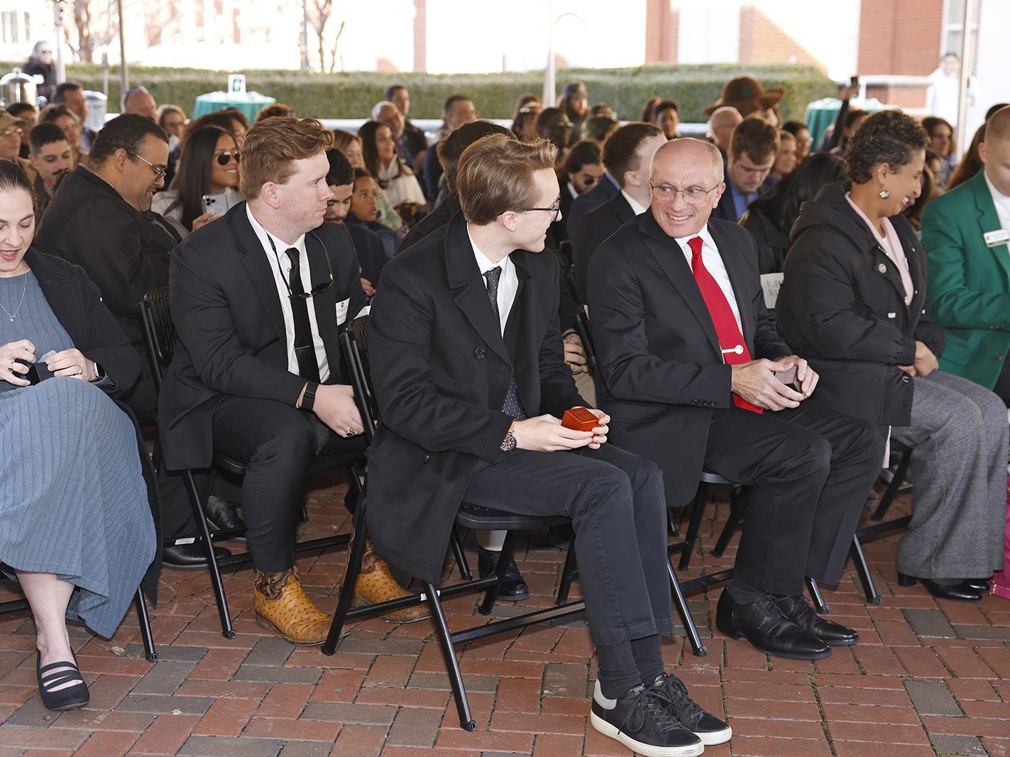 Scott Stewart Sr. and Scott Stewart Jr. receiving their class rings