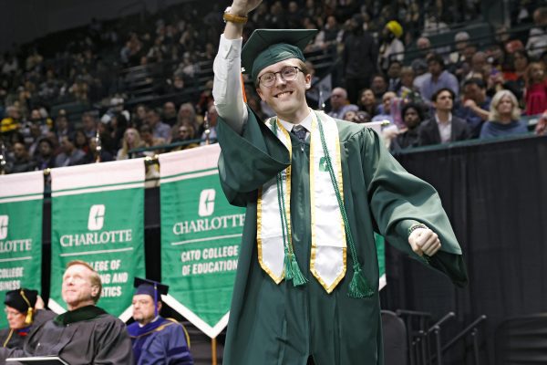 Scott Stewart Jr. signals success to his father at graduation ceremony