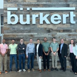 Students with Burkert engineers and Robert Keynton, dean of the William States Lee College of Engineering, at company headquarters