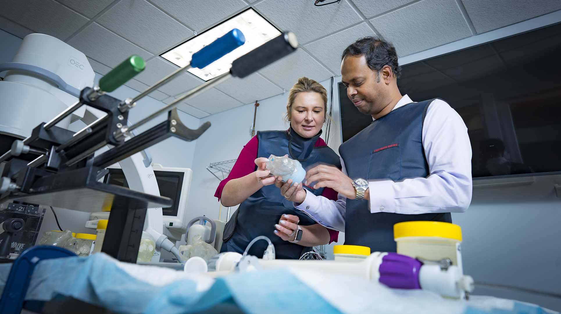 Saravana and Katherine Kumar working with the AltaValve medical device in the lab