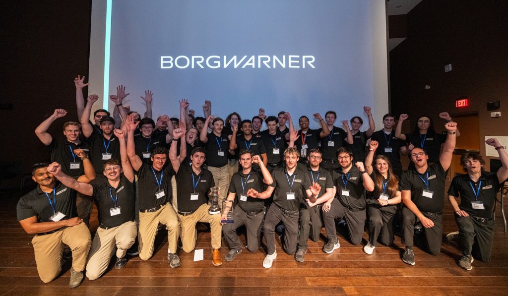 49ers Racing EV and IC teams posing with trophies at Student Night