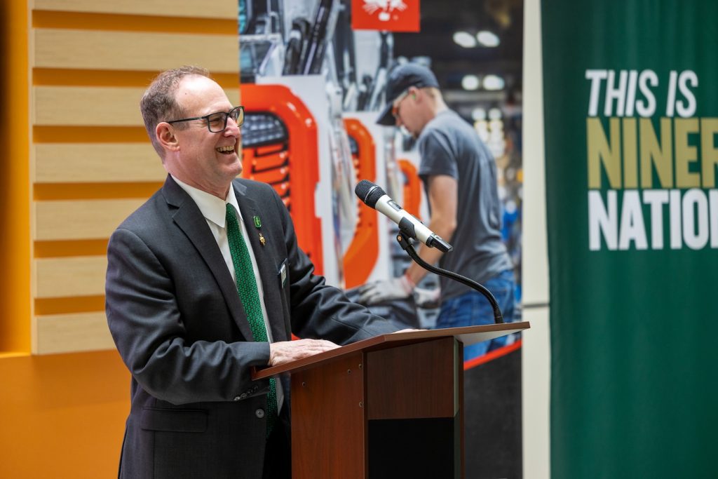 Dean Rob Keynton stands at podium
