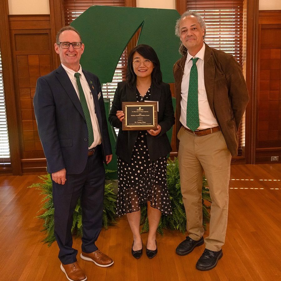 Dean Rob Keynton and Associate Dean for Academic Affairs Brett Tempest presenting award to Tina Chen