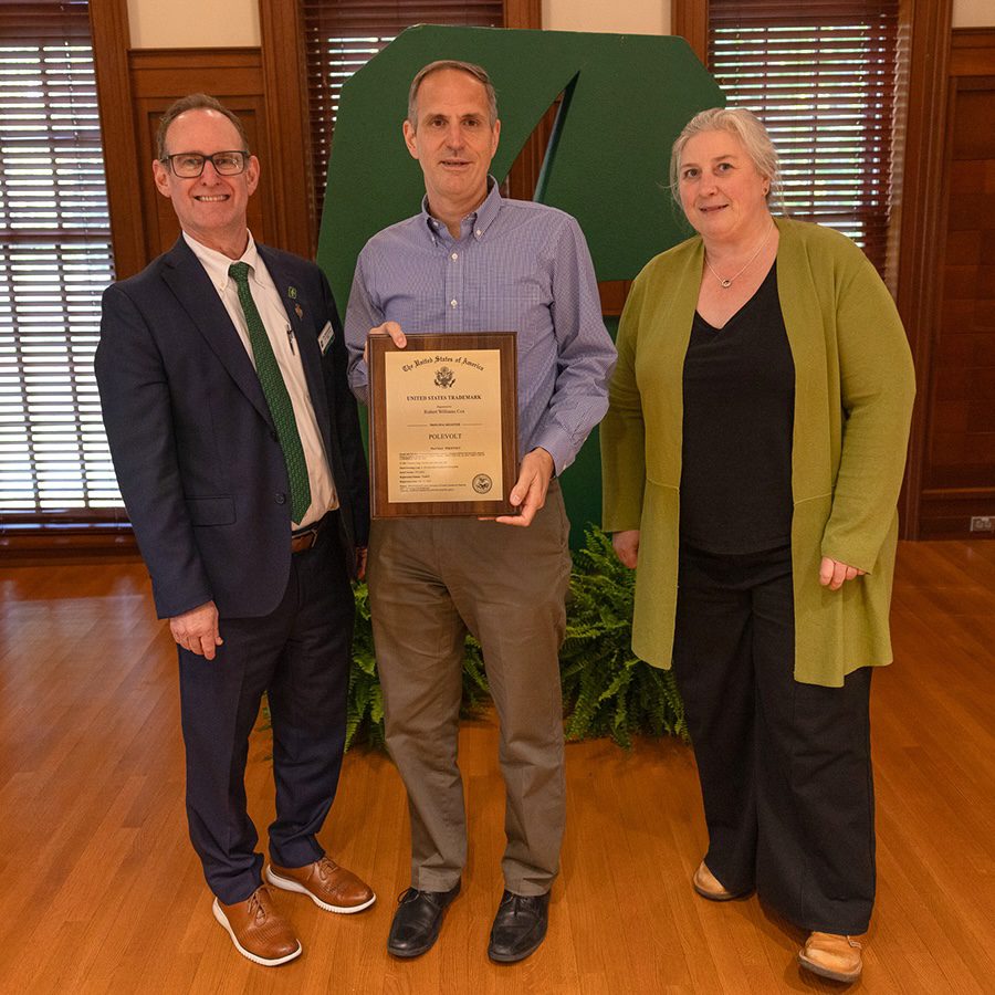 Dean Rob Keynton and Associate Dean for Research Brigid Mullany presenting award to Rob Cox