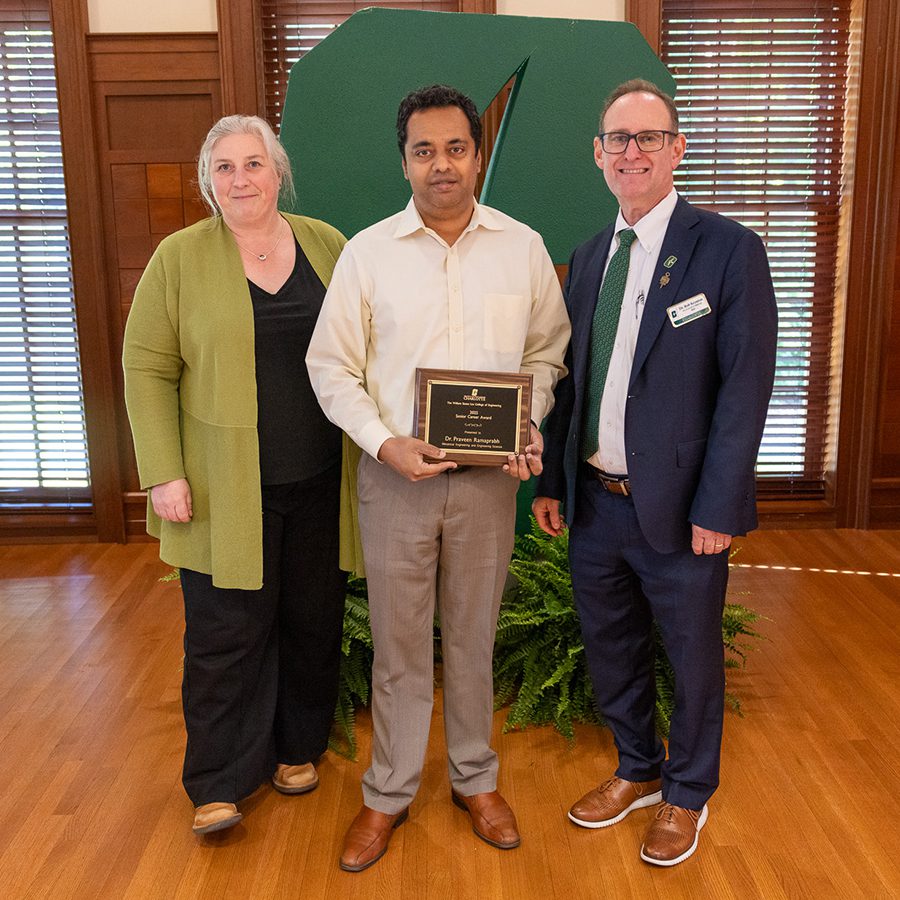Associate Dean for Research Brigid Mullany and Dean Rob Keynton presenting award to Praveen Ramaprabhu