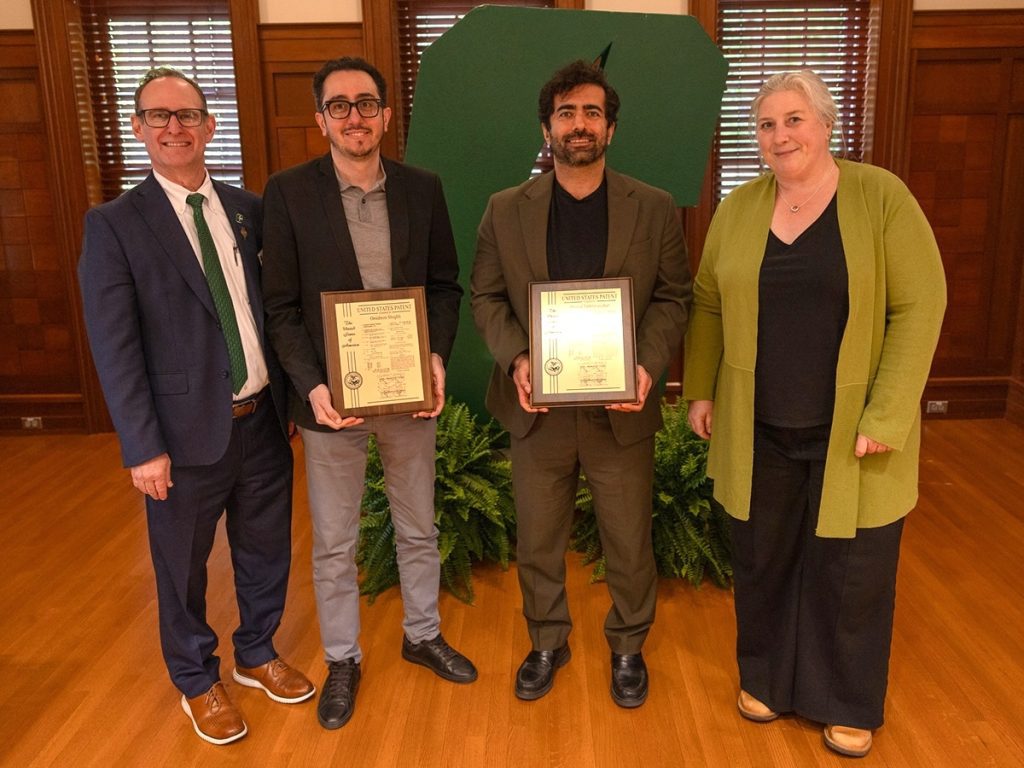 Dean Rob Keynton and Associate Dean for Research Brigid Mullany presenting award to Omid Shoghli and Hamed Tabkhi