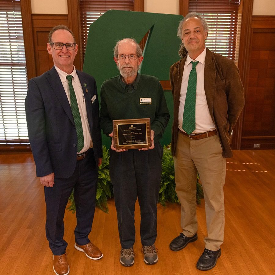 Dean Rob Keynton and Associate Dean for Academic Affairs Brett Tempest presenting award to Ron Smelser