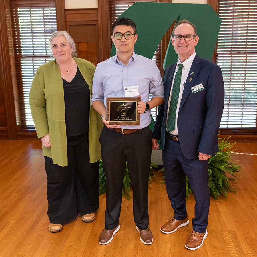 Associate Dean for Research Brigid Mullany and Dean Rob Keynton present award to Youxing Chen