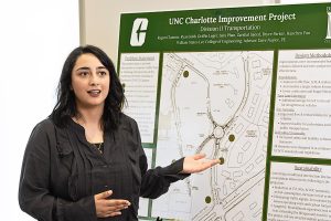 Saeed explaining traffic analysis on posterboard
