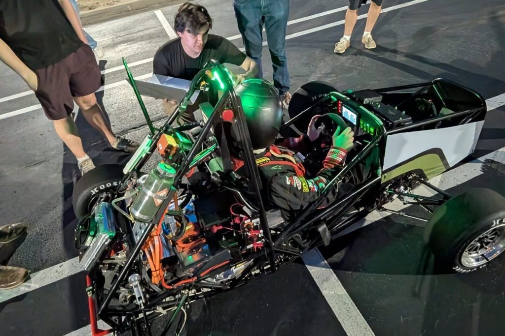 49ers Racing EV team with racecar
