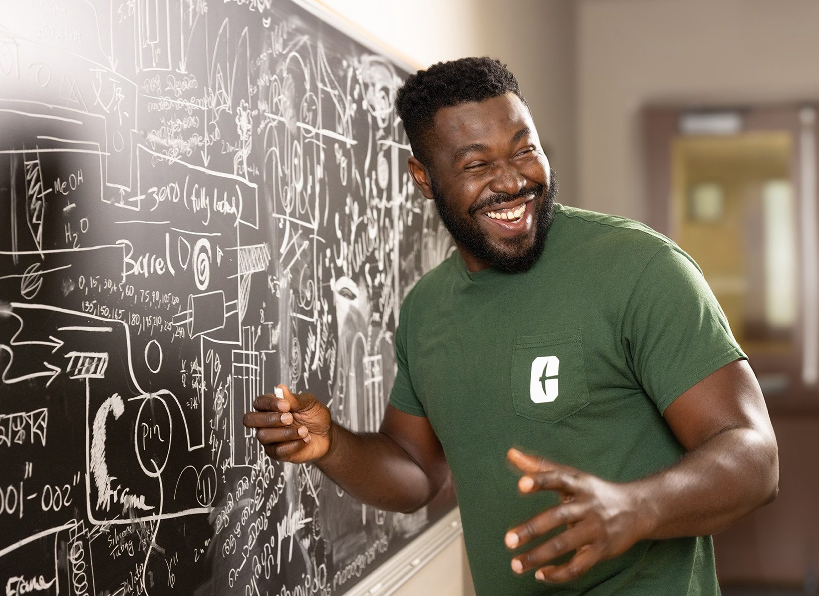Chideraa Ndubuisi standing at blackboard