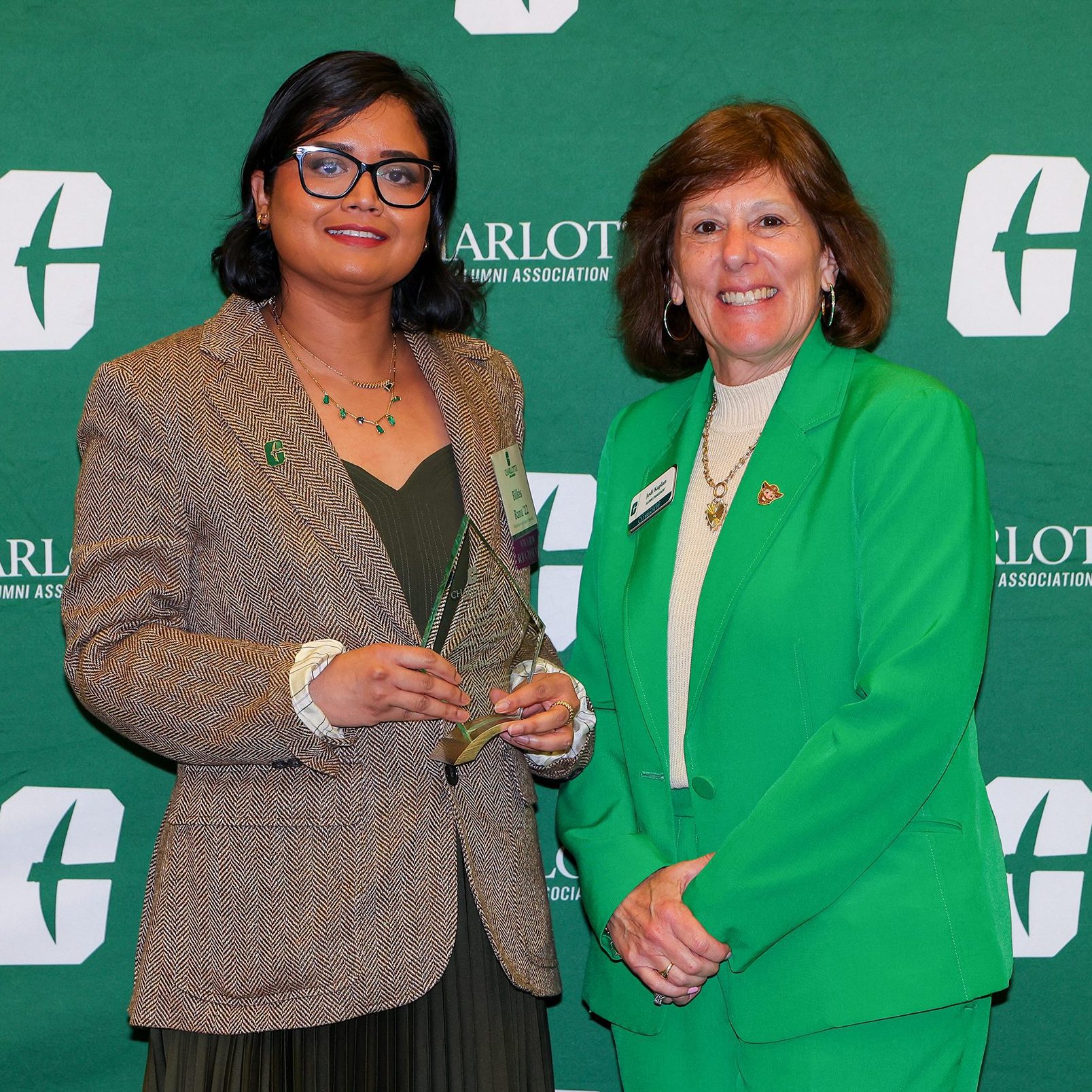 Banu receives award from Associate Vice Chancellor of Alumni Engagement, Jodi Kaplan.
