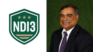 NDI3 green shield logo with gold stars beside a portrait of a smiling Mesbah Uddin wearing a coat in tie